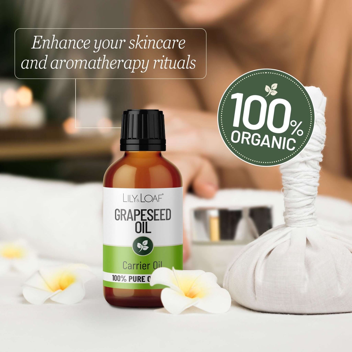 Bottle of Lily & Loaf Grapeseed Oil with a 100% Organic label on a blurred background.