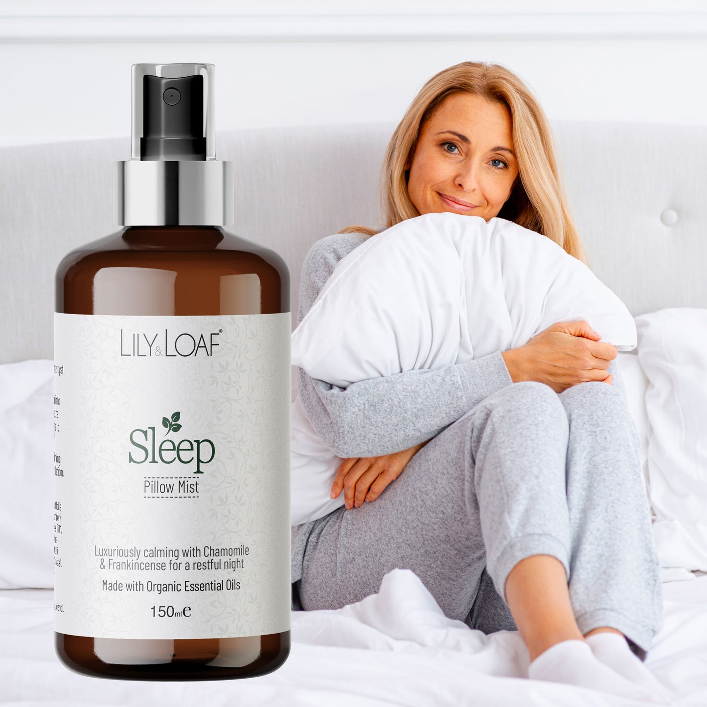 Bottle of Lily Loaf Sleep Room Mist with a woman holding a pillow in the background