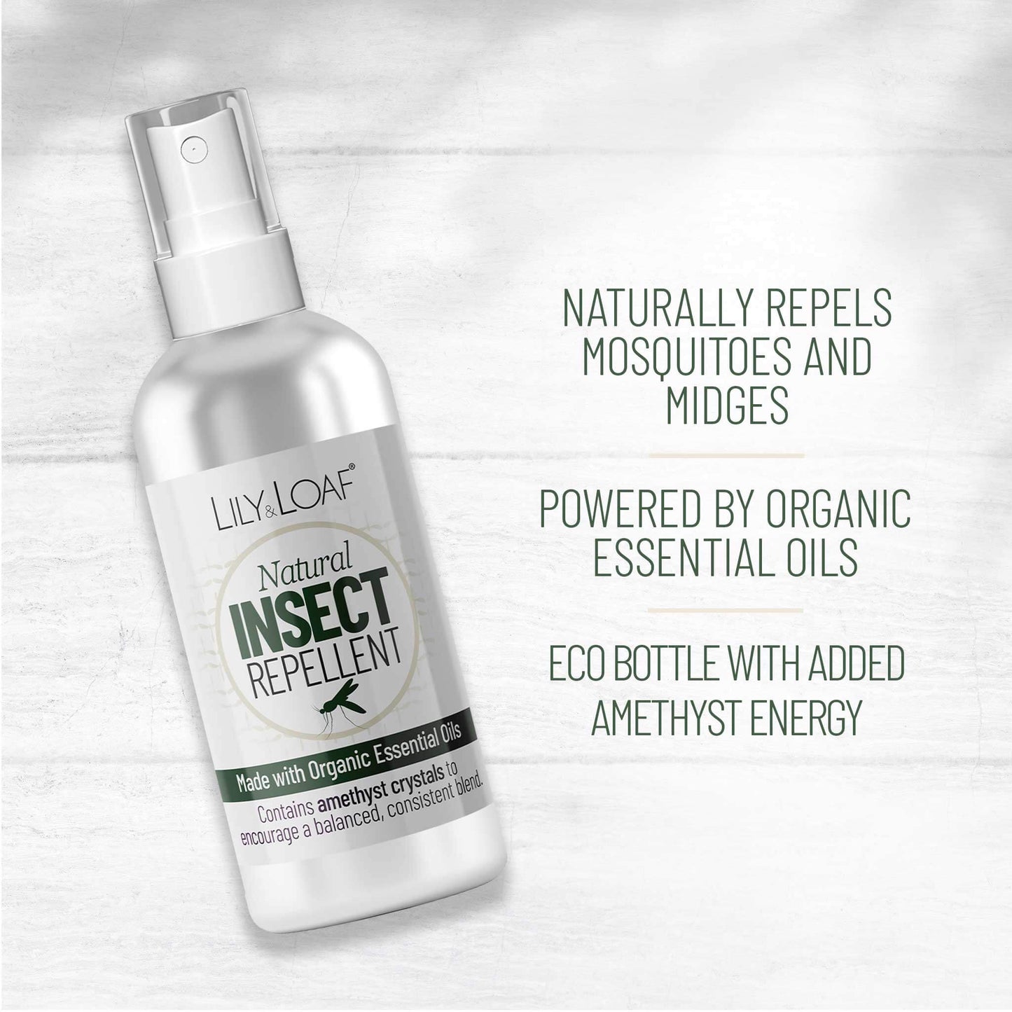 Lily & Loaf natural insect repellent bottle on a light wooden background
