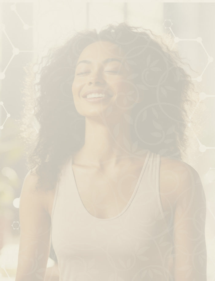 Woman with braided hair smiling against a light background