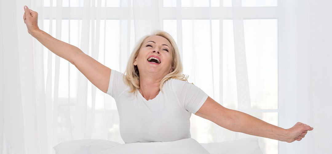 middleage lady waking happy after looking at Biohacking