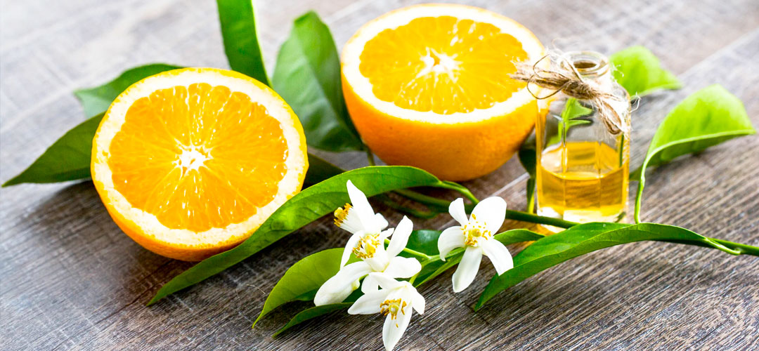 fresh oranges with orange oil
