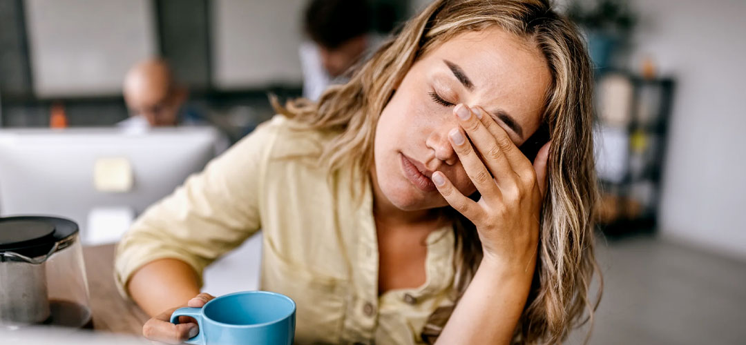 female falling asleep at desk
