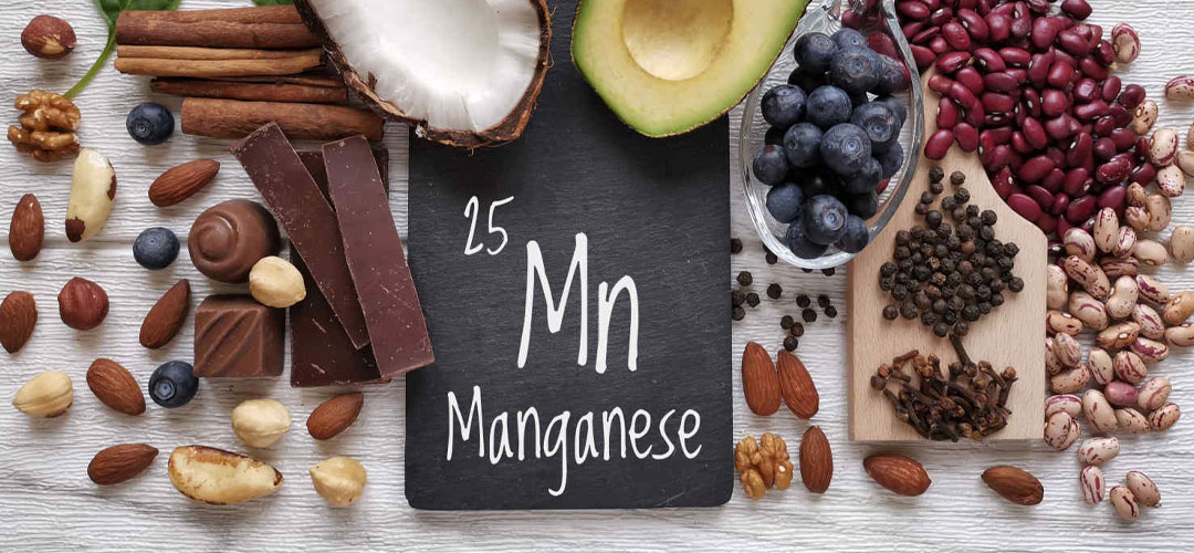 Variety of manganese-rich foods, including nuts, seeds, chocolate, avocado, and berries, highlighting their role in supporting bone health and metabolism