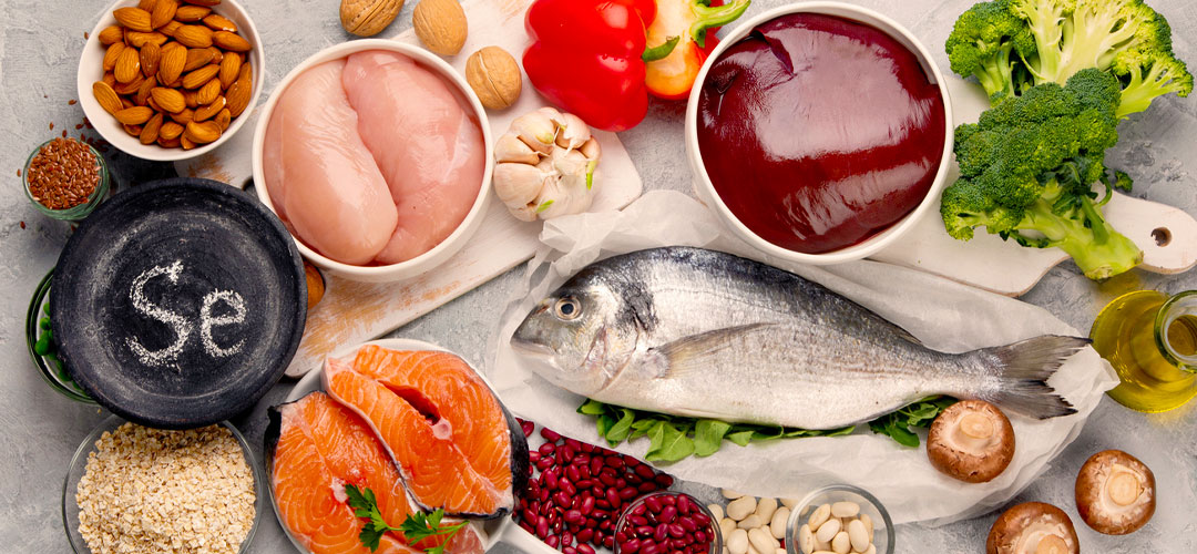 Selection of selenium-rich foods including fish, chicken, nuts, liver, and vegetables, highlighting their role in health and optimal nutrient intake