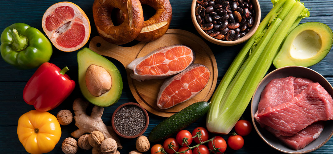 Phosphorus-rich foods including salmon, meat, avocado, nuts, beans, and vegetables, highlighting their role in bone health and energy production