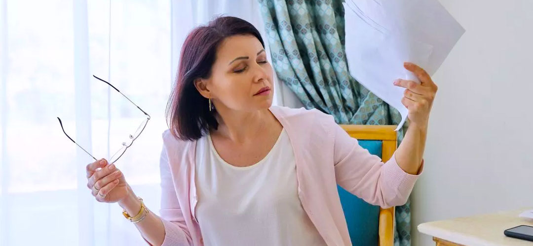 A lady experiencing hot flashes: a common menopause symptom