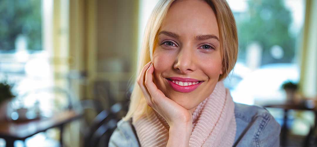 40 plus lady in cafe feeling healthy
