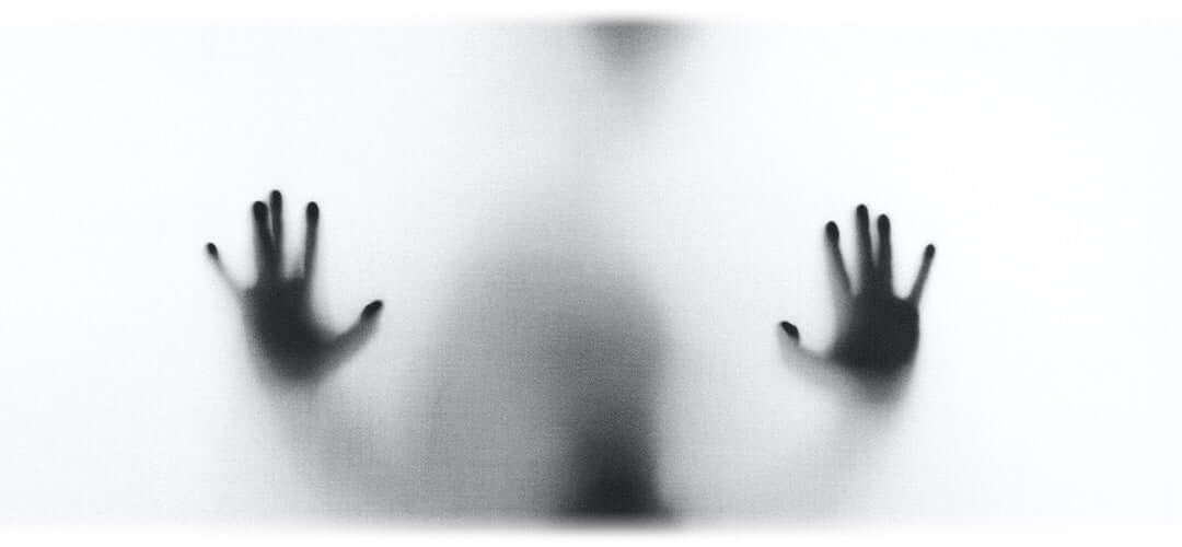 Shadow of a person surrounded in fog.