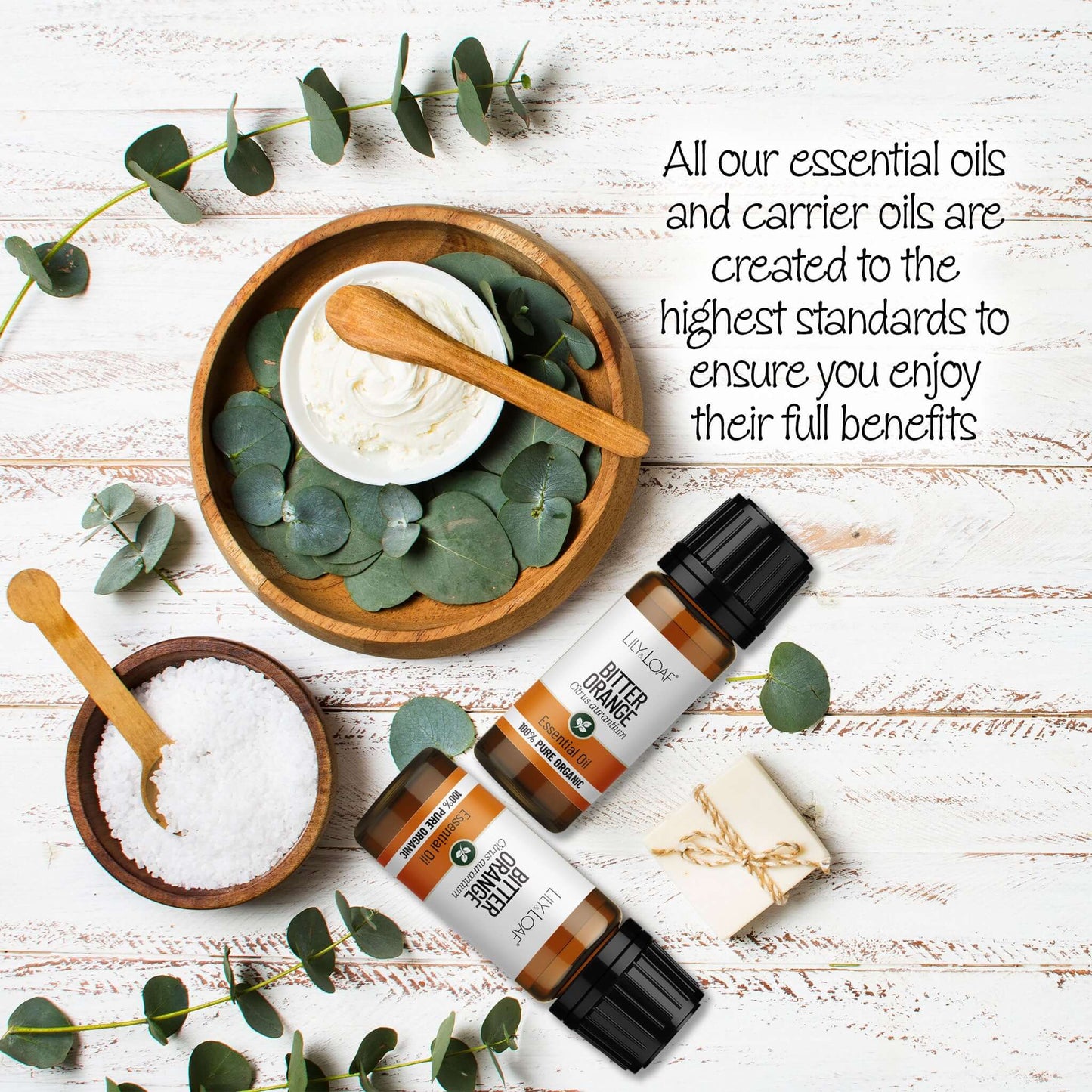 Bitter Orange Essential Oil with eucalyptus leaves on a wooden surface