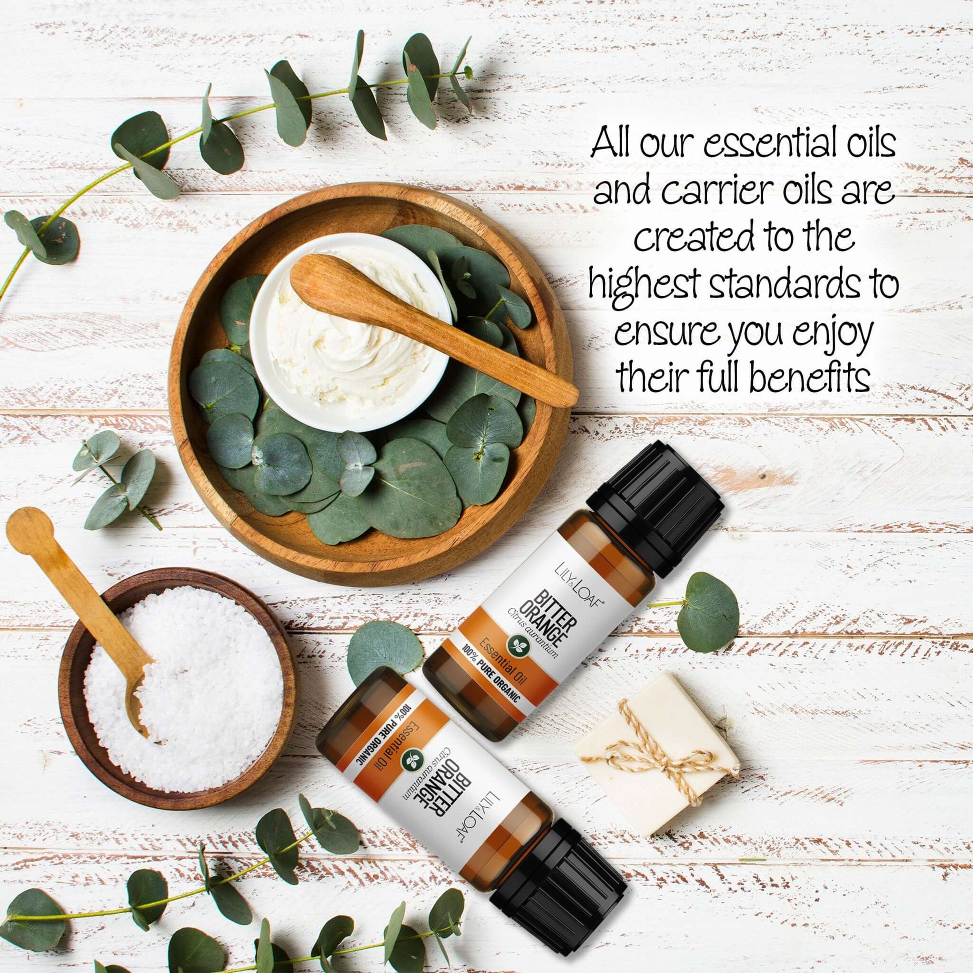 Bitter Orange Essential Oil with eucalyptus leaves on a wooden surface