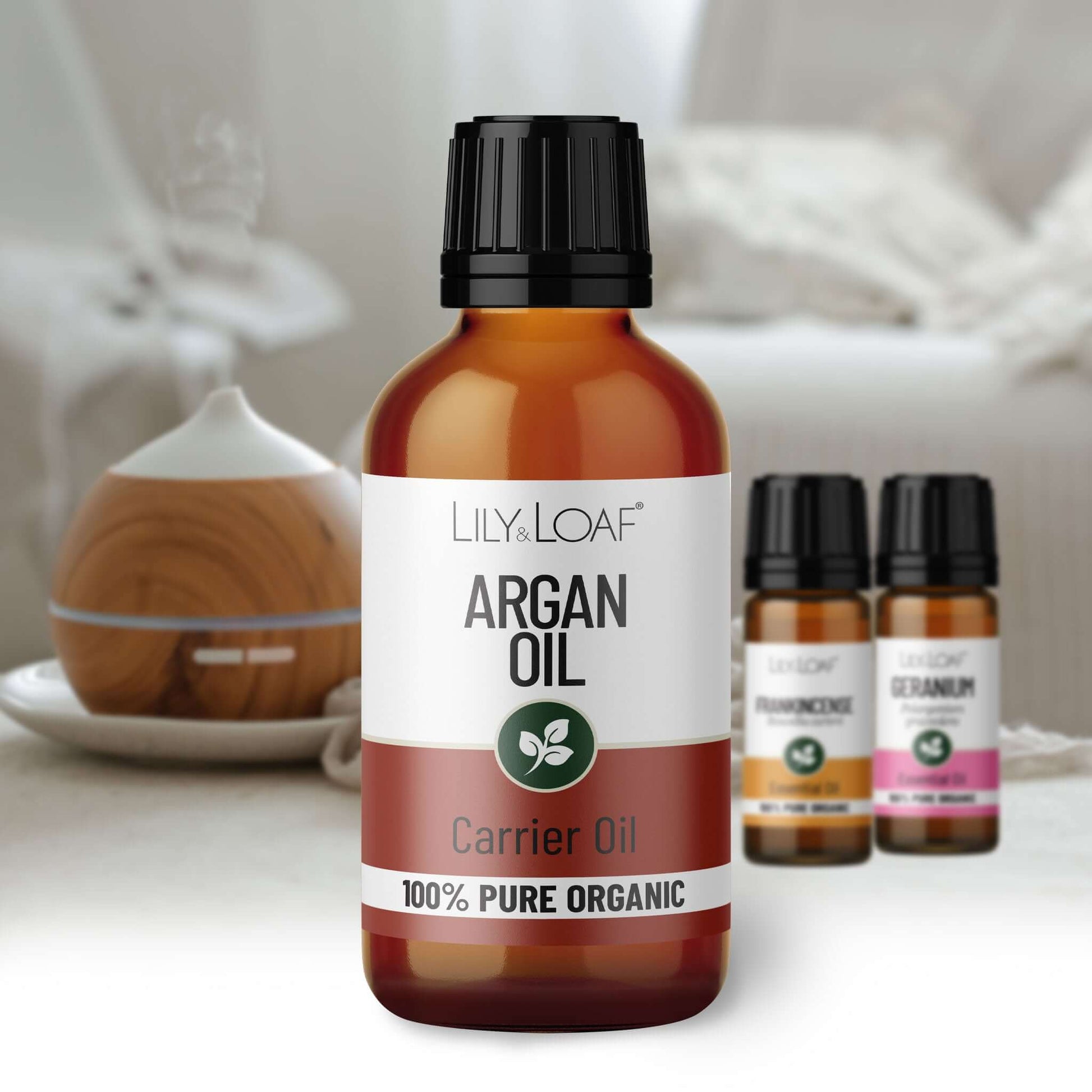 Bottle of Lily & Loaf Argan Oil with other small bottles in the background