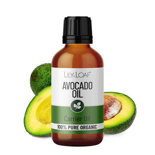 Bottle of Lily & Loaf Avocado Oil with avocados on a white background