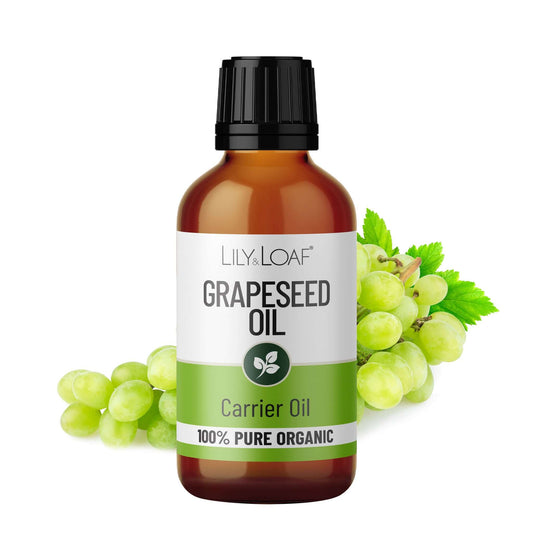 Bottle of Lily & Loaf Grapeseed Oil with grapes on a white background