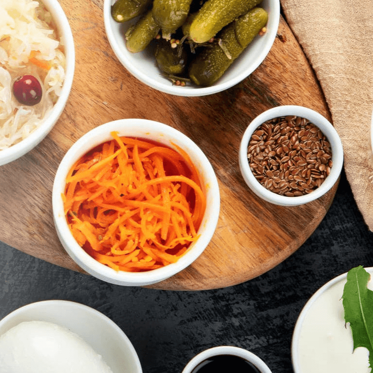 A selection of probiotic rich foods including sauerkraut and fermented yoghurt