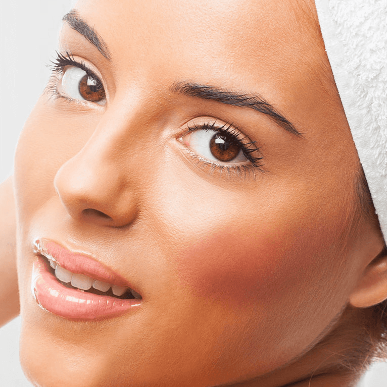 A close up of a youthful woman's face