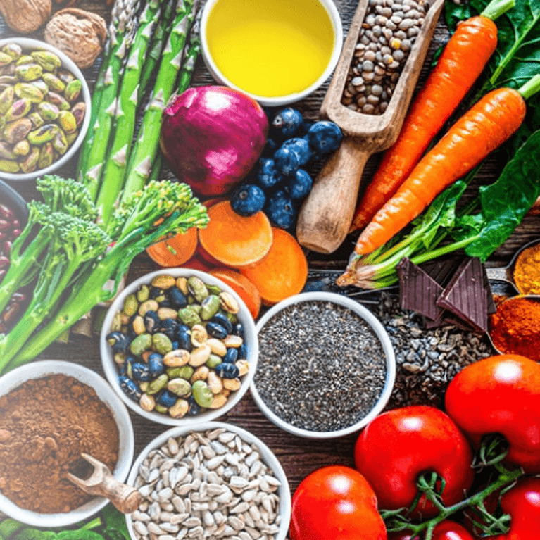 An array of high fibre foods, including fruit, vegetables, pulses and grains