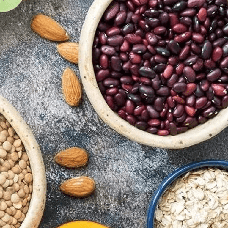 A selection of foods rich in iron, including nuts and pulses
