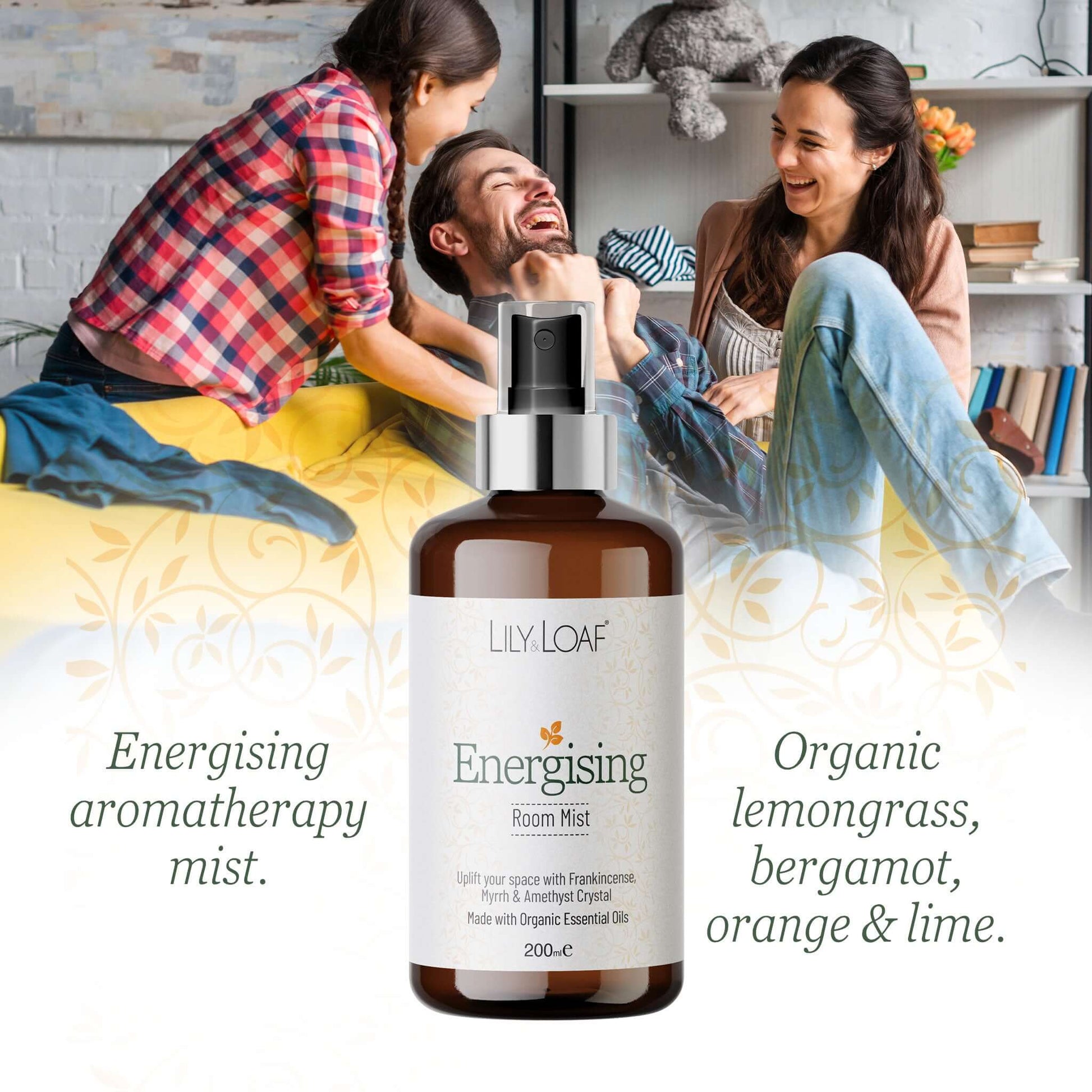 Bottle of Lily & Loaf Energising Room Mist with a family in the background