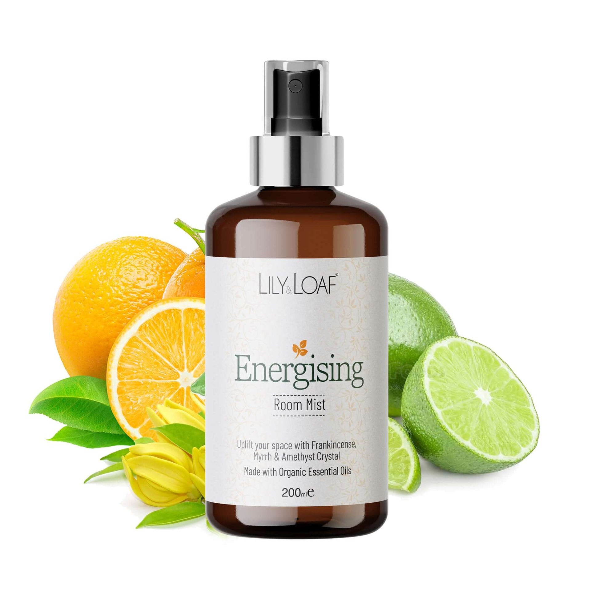 Bottle of Lily Loaf Energising Room Mist with oranges and limes on a white background