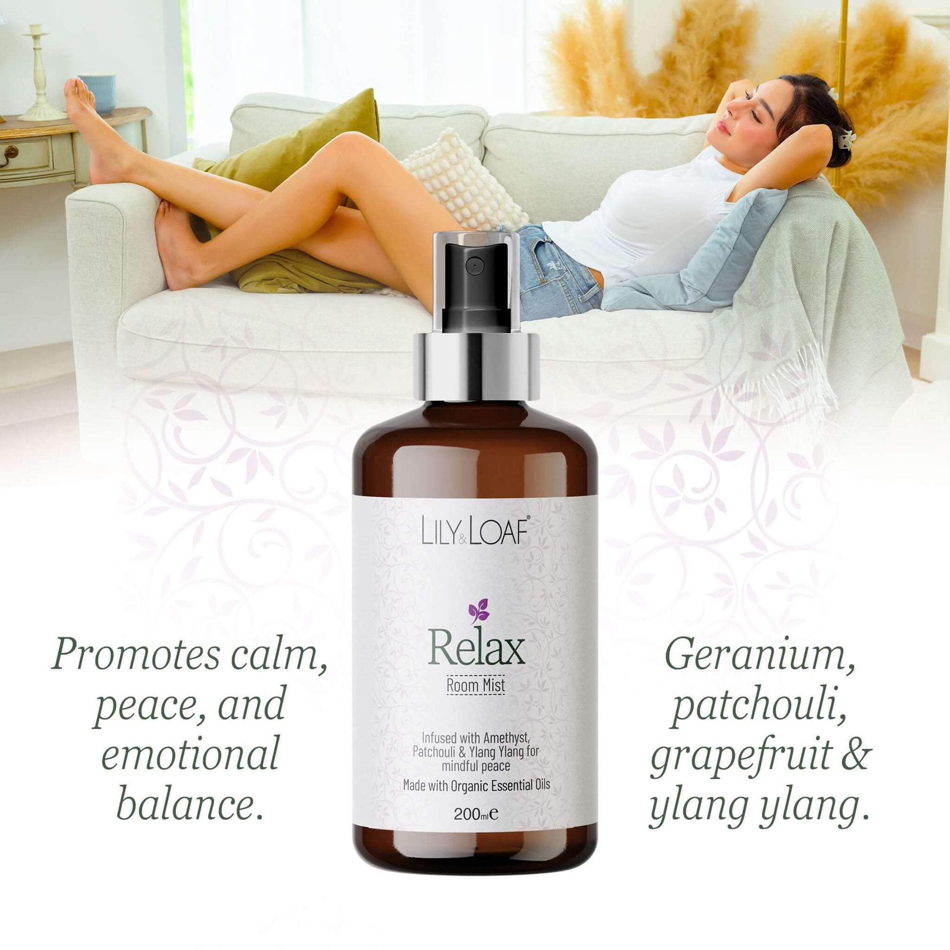 Bottle of Lily Loaf Relax room mist with a woman relaxing on a couch in the background.
