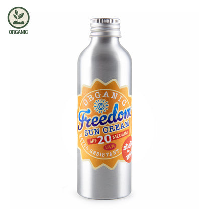Metallic bottle of Organic Freedom Sun Cream SPF 20 on a white background