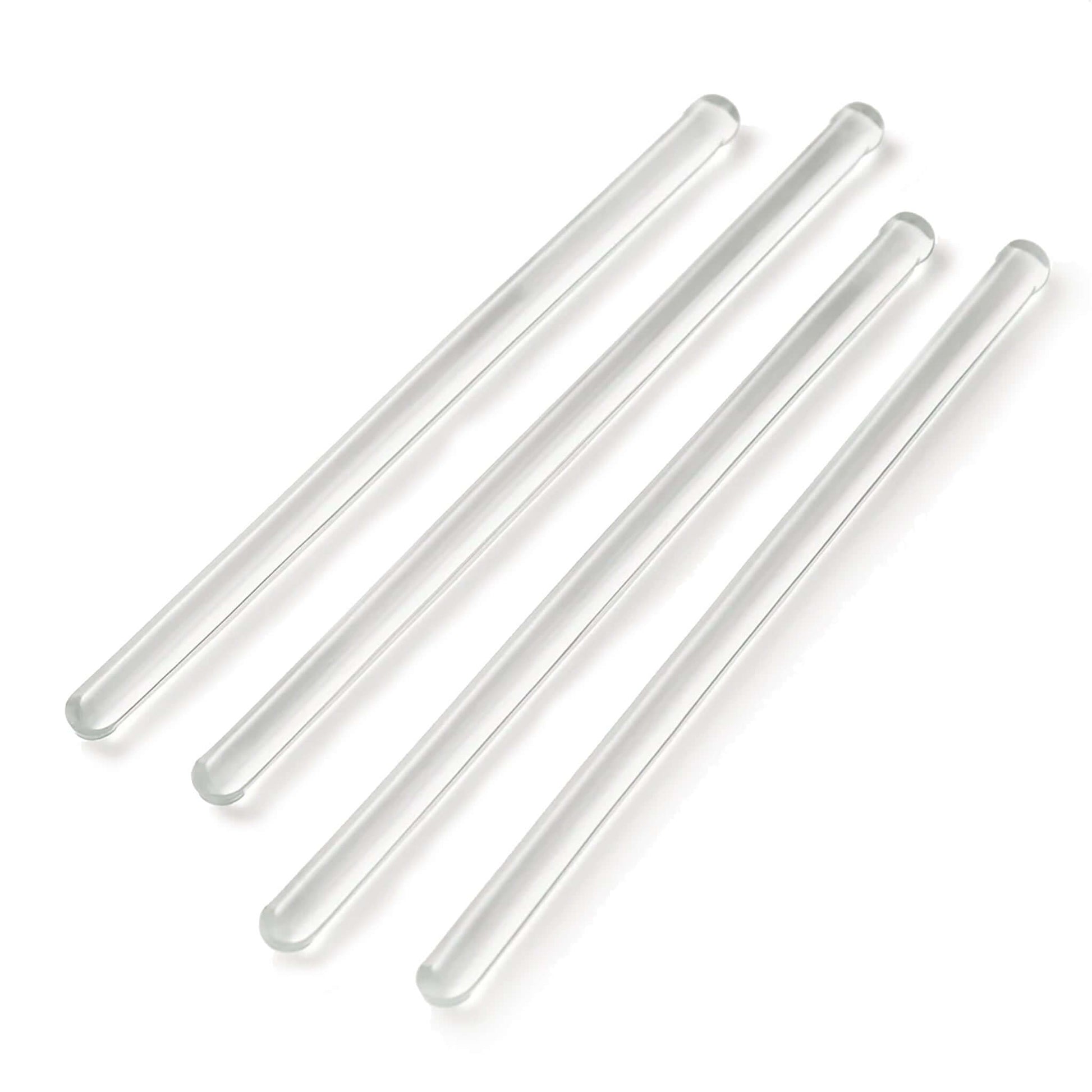 Four clear glass rods on a white background