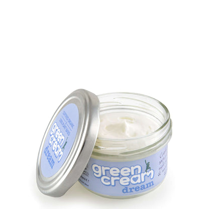 Open jar of Green Cream Dream with silver lid and light blue label, showing smooth white cream inside.