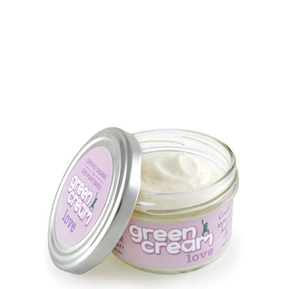 Open jar of Green Cream Love with silver lid and pink label, showing smooth white cream inside.