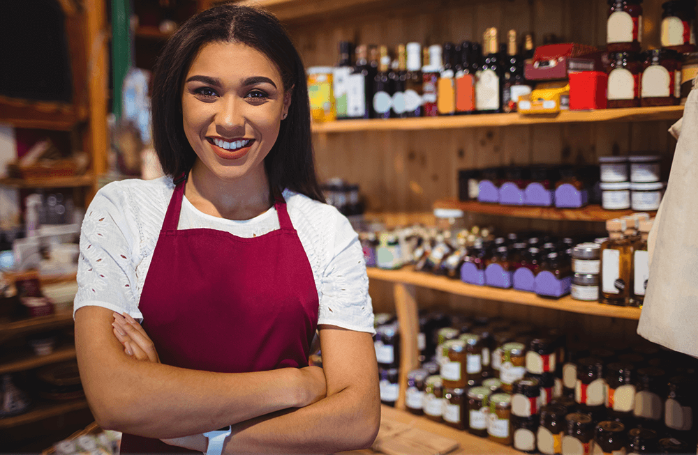 A health shop assistant stood in front of a display.