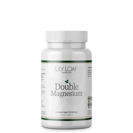 A bottle of Lily & Loaf Double Magnesium supplements with white and green labelling.