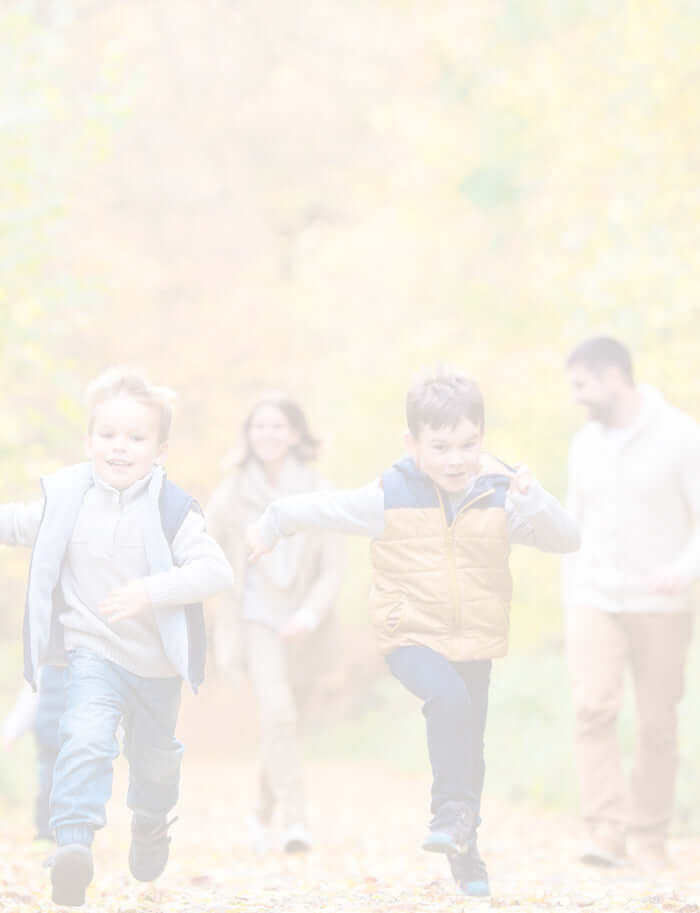 A family having fun in an autumnal forest