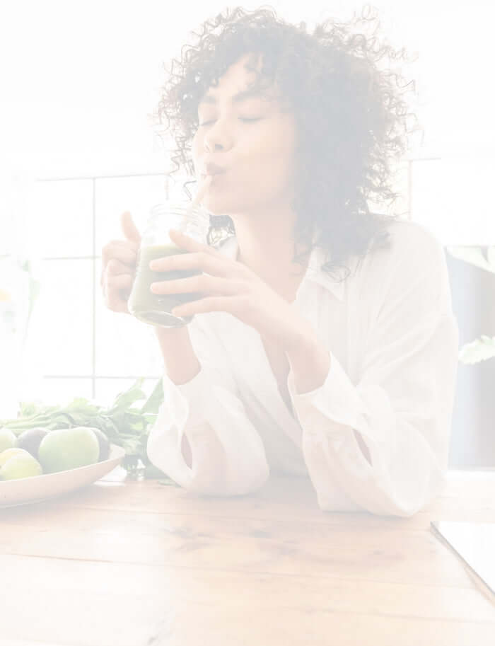 lady enjoying a chlorophyll smoothie