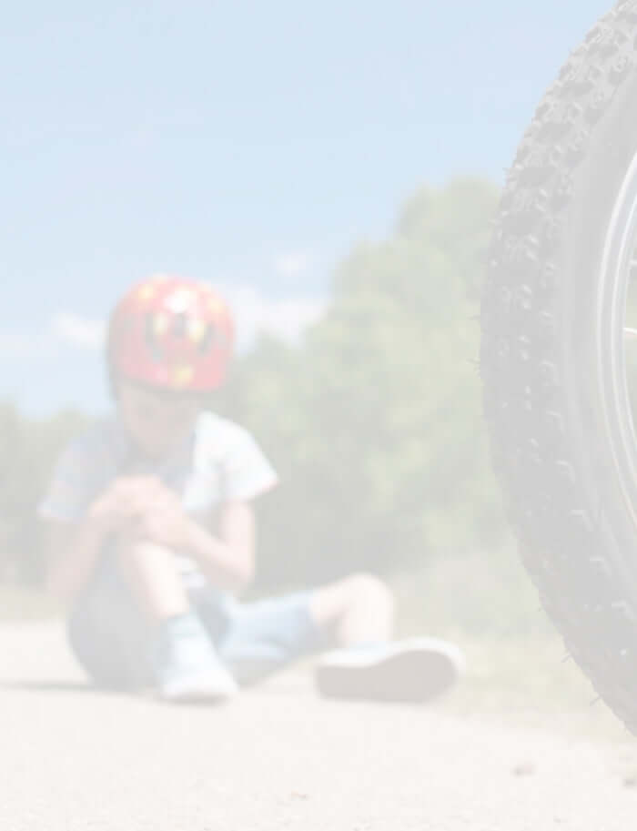 young boy fell of his bike