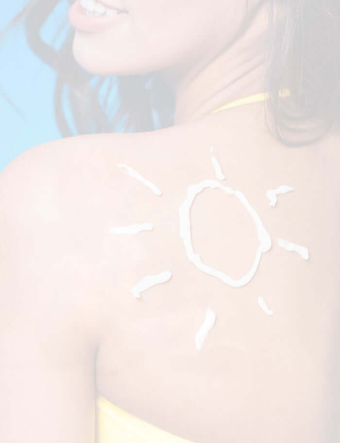 Lady with a sun on her shoulder made from sunscreen