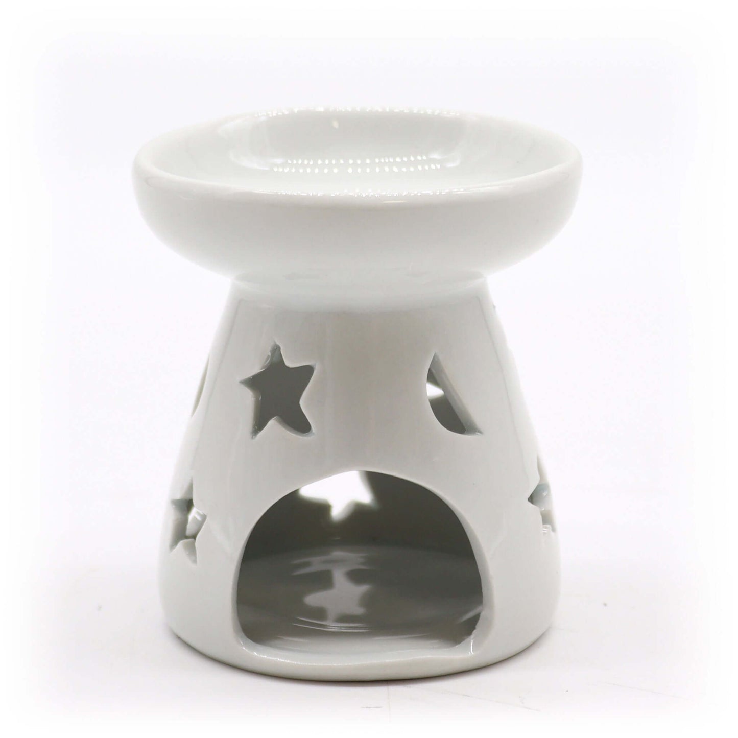 White ceramic tealight oil warmer with moon and star cut-out design, ideal for essential oil or wax melt use.