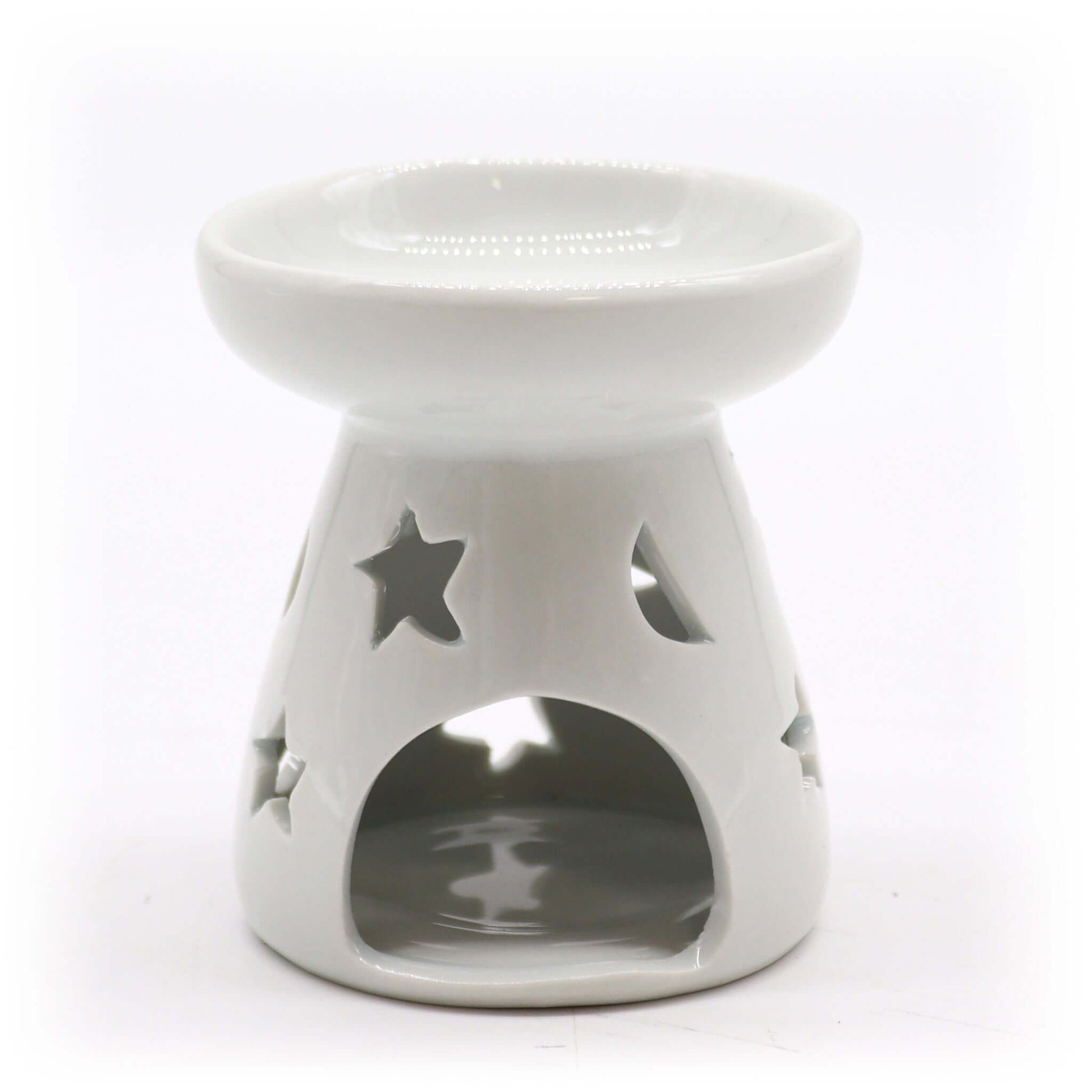White ceramic tealight oil warmer with moon and star cut-out design, ideal for essential oil or wax melt use.