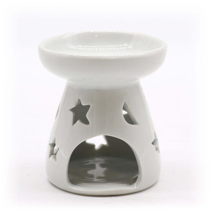 White ceramic tealight oil warmer with moon and star cut-out design, ideal for essential oil or wax melt use.