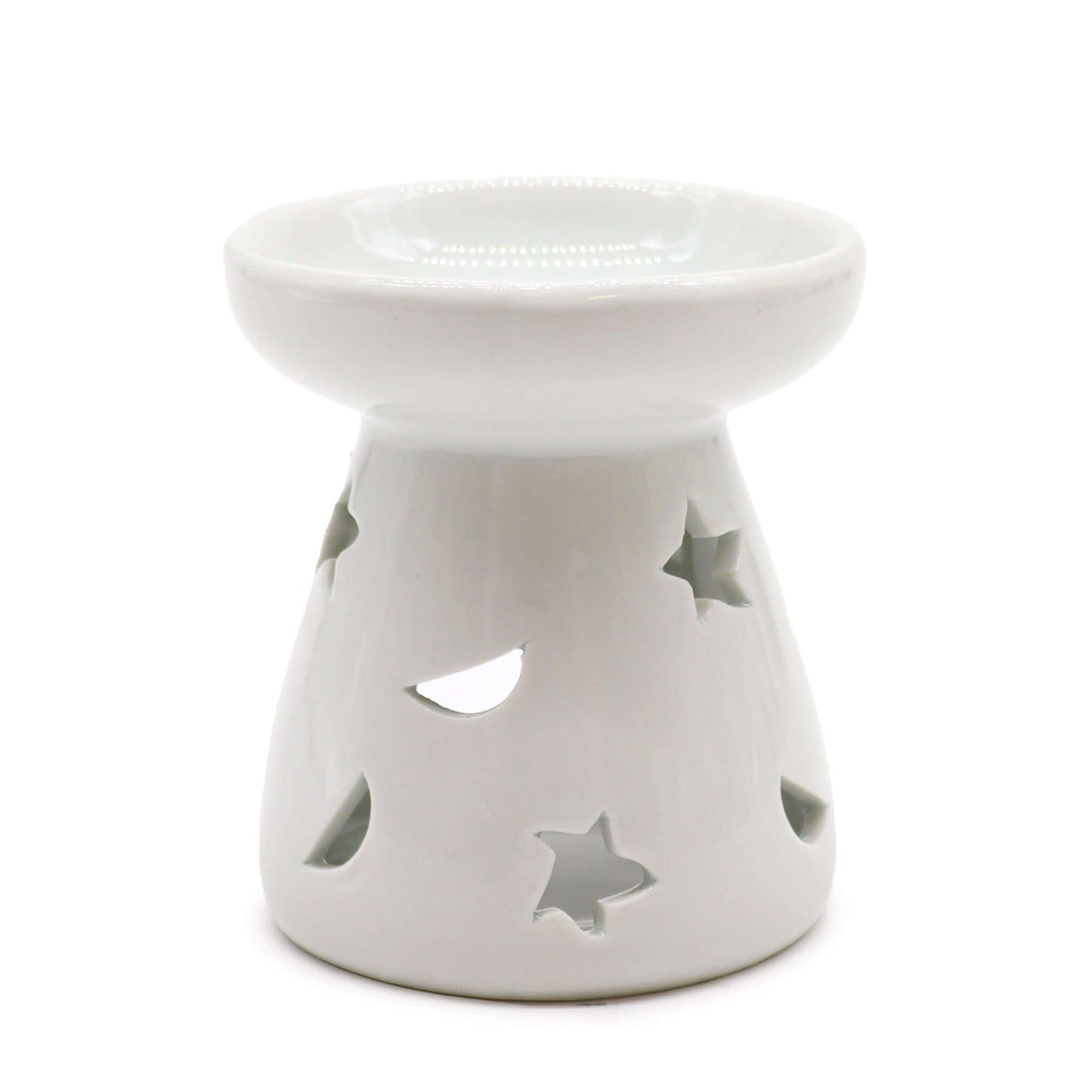 A white ceramic aromatherapy oil warmer with cut-out stars and a moon design.