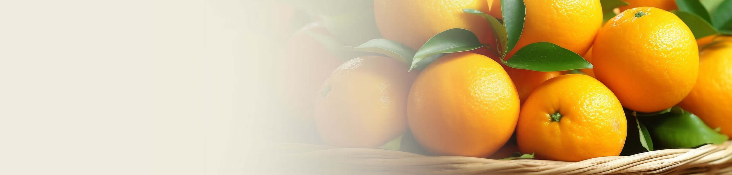 Fresh mandarins with green leaves in a wicker basket, symbolising the zesty and uplifting aroma of Mandarin Essential Oil.