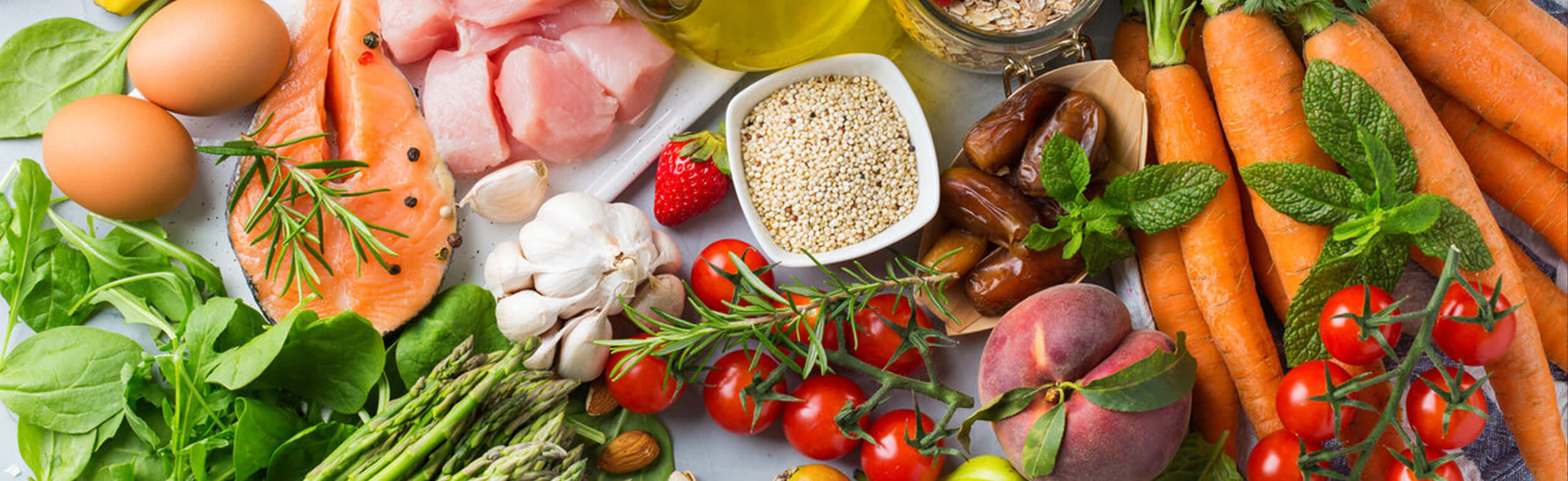 A variety of healthy foods such as fruits, vegetables and grains.