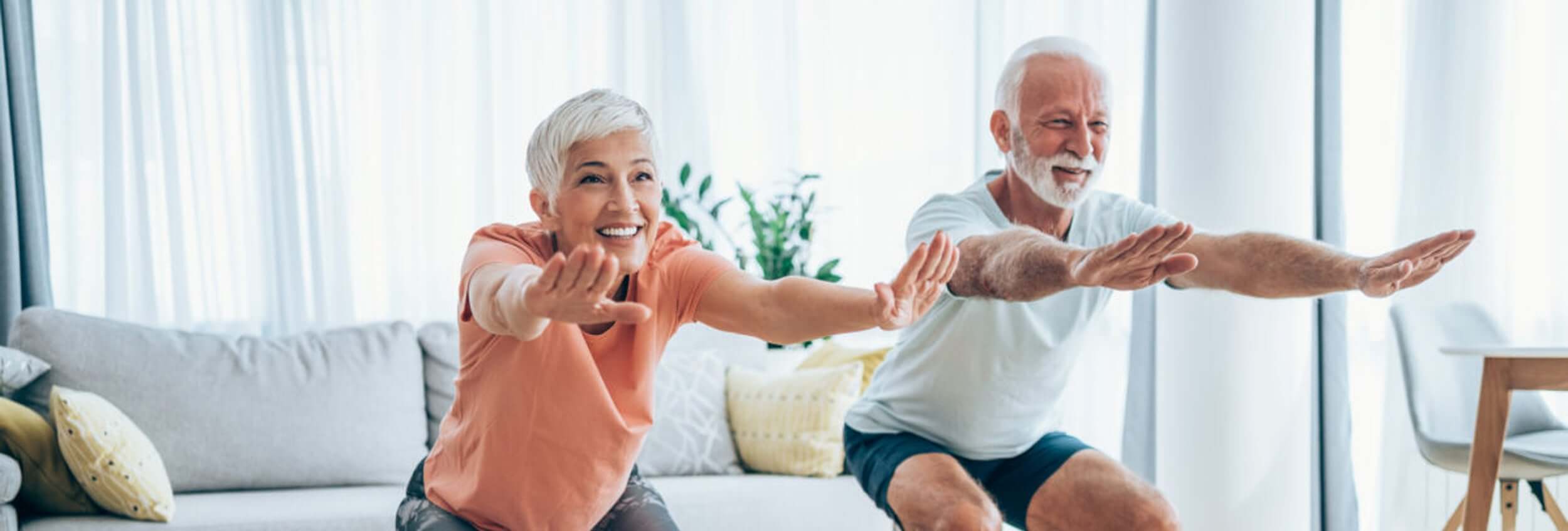 Two people doing workout exercises at home