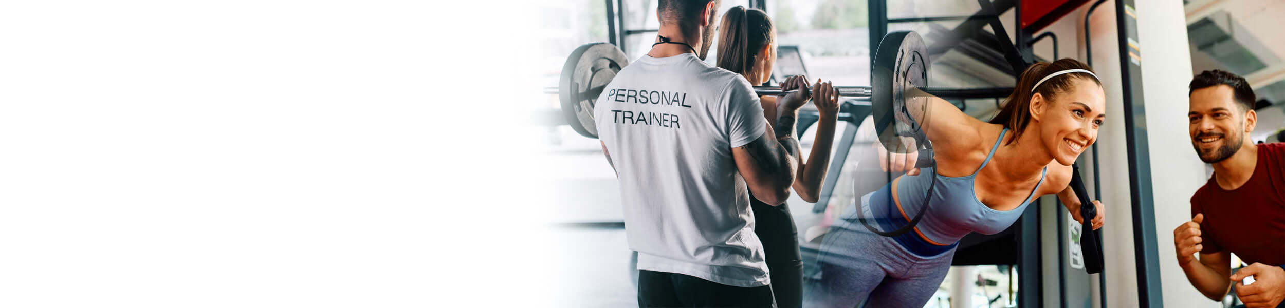 Personal trainer assisting clients with weightlifting and strength training in a gym.