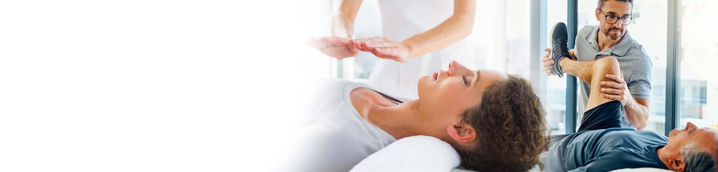 Kinesiologist performing muscle testing and rehabilitation therapy on a patient in a clinical setting.