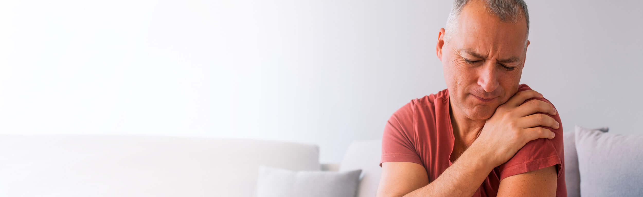 A man suffering shoulder pain