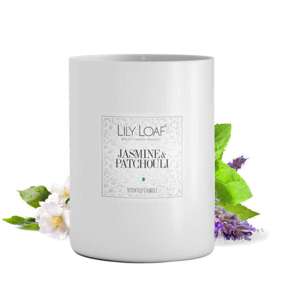 Jasmine & Patchouli Soy Wax Candle with ingredients behind