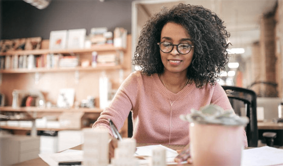 A woman completing work at a desk