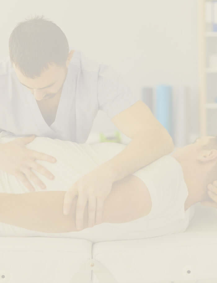 Osteopath using hands-on techniques to adjust a patient’s spine for pain relief.