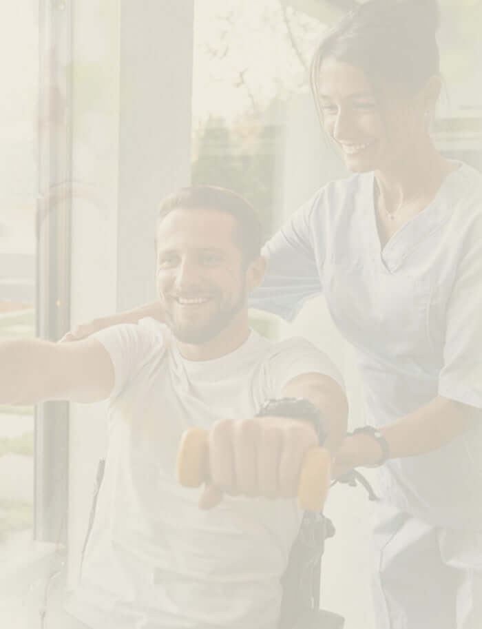 A physiotherapist guiding a patient through a strength and mobility exercise.