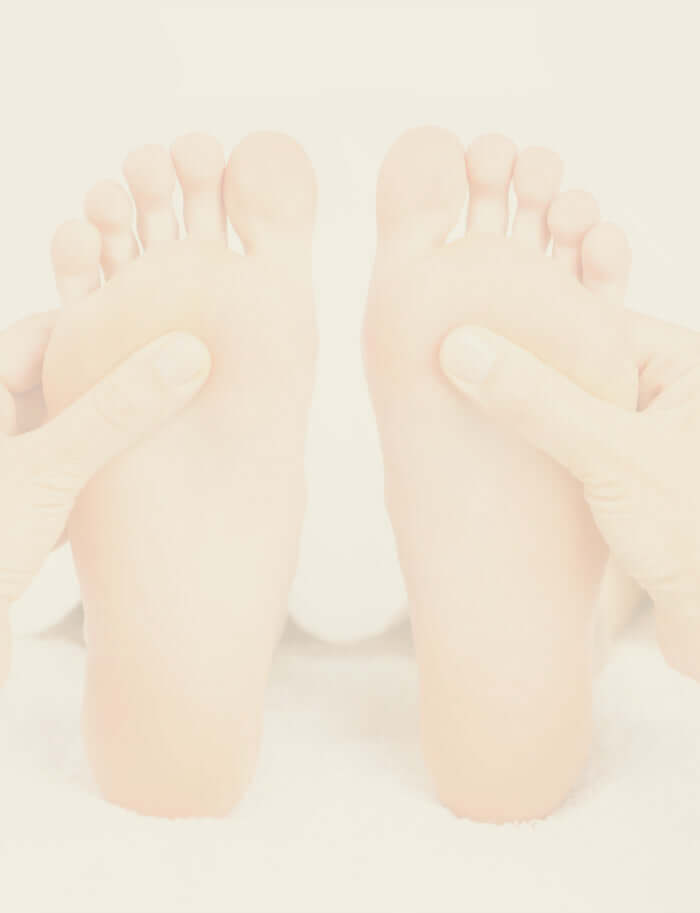 Close-up of foot massage, illustrating reflexology practice for relaxation and balance.
